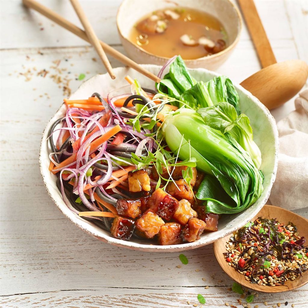 Asian Buddha bowl with yakisoba and tempeh teriyaki